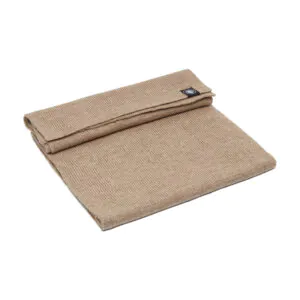 Folded beige merino scarf, soft and warm.